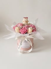 White and pink candle bouquet with bear topper
