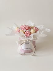 White and pink candle bouquet with keepsake bear topper